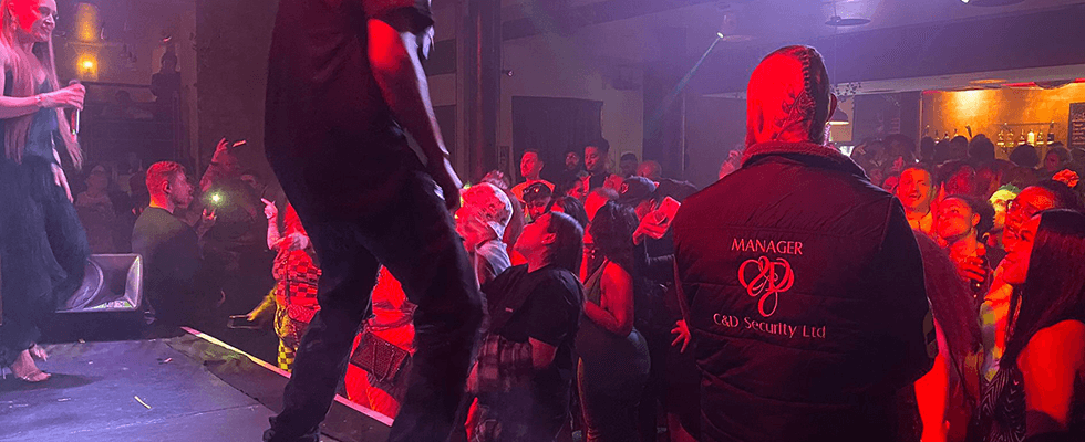 C&D close protection operative working a venue under low light